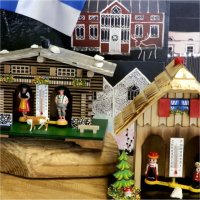Different types of house-shaped thermometers and house-themed postcards